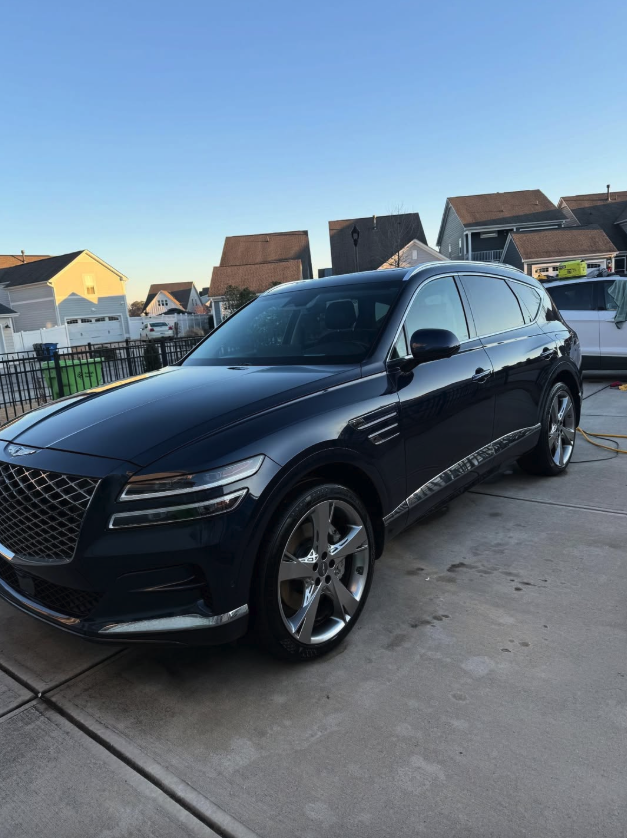 Genesis GV80 navy detailed at golden hour